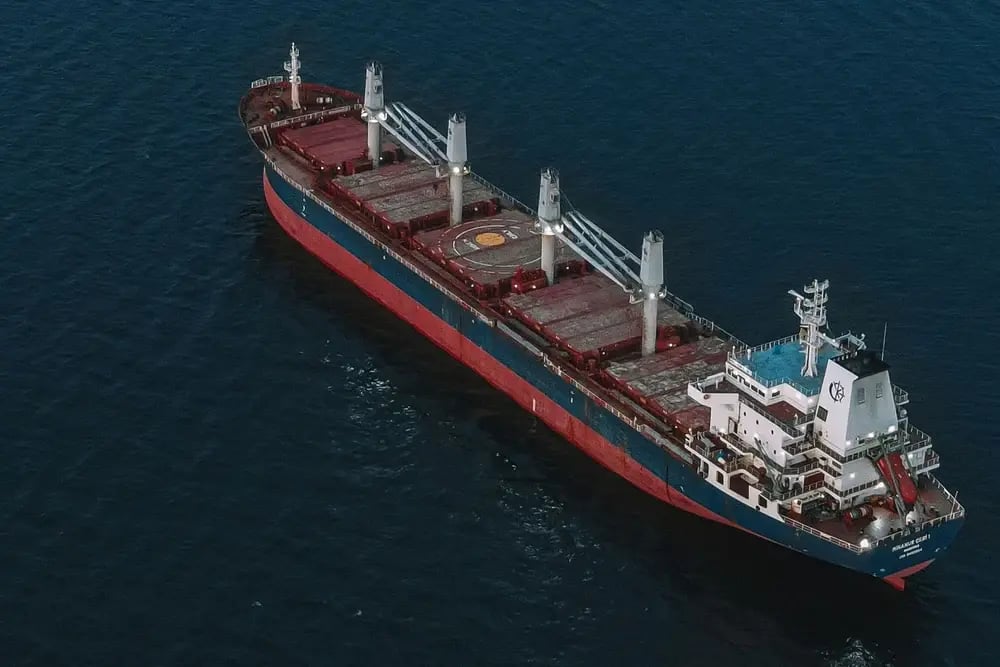 Aerial view of a cargo ship crossing the open sea
