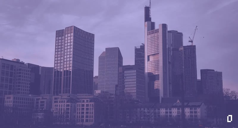 Sustainability reporting frameworks: the Frankfurt financial district skyline at dusk