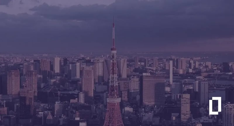 Japan climate disclosure rules: Tokyo Tower rising above the Tokyo skyline at dusk
