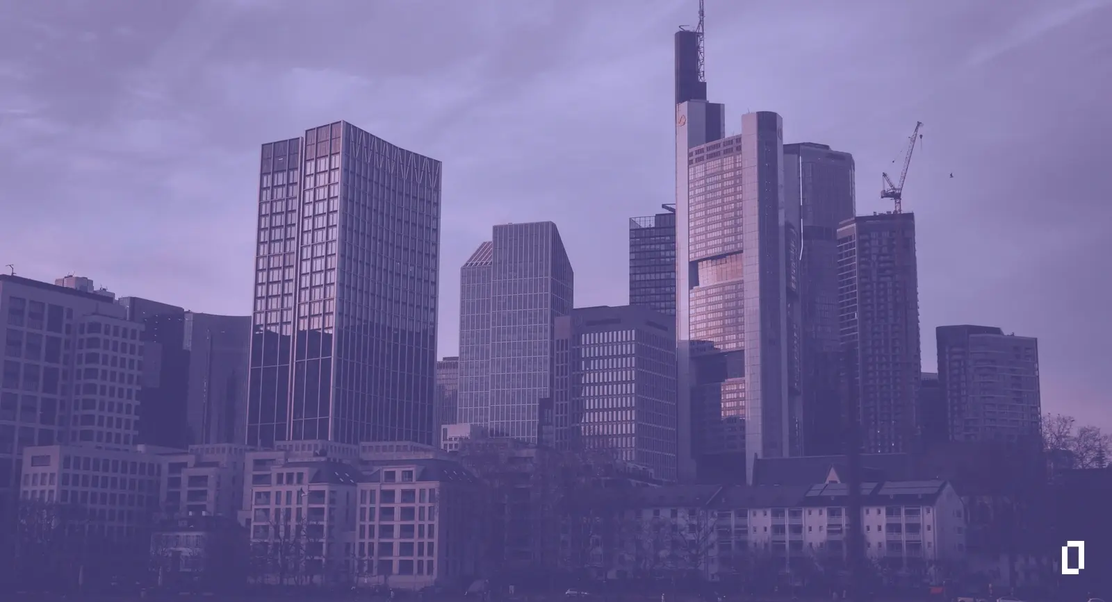 Sustainability reporting frameworks: the Frankfurt financial district skyline at dusk