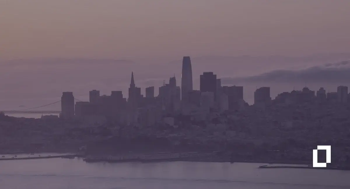 California SB 253 climate disclosure rules: San Francisco skyline across the bay at dusk